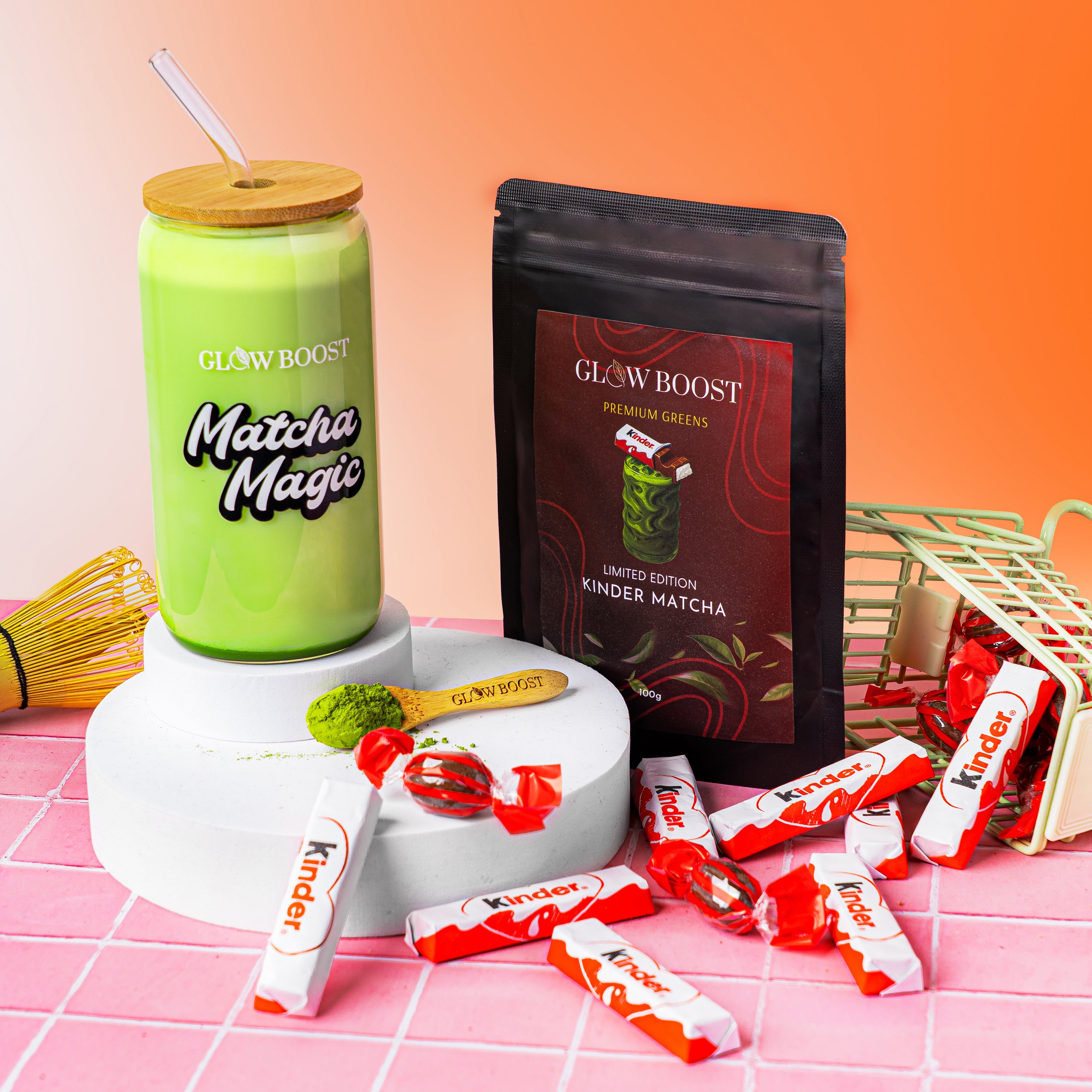 Matcha Magic tumbler, Gluw Boost matcha powder, and red packets on a pink and orange gradient background.