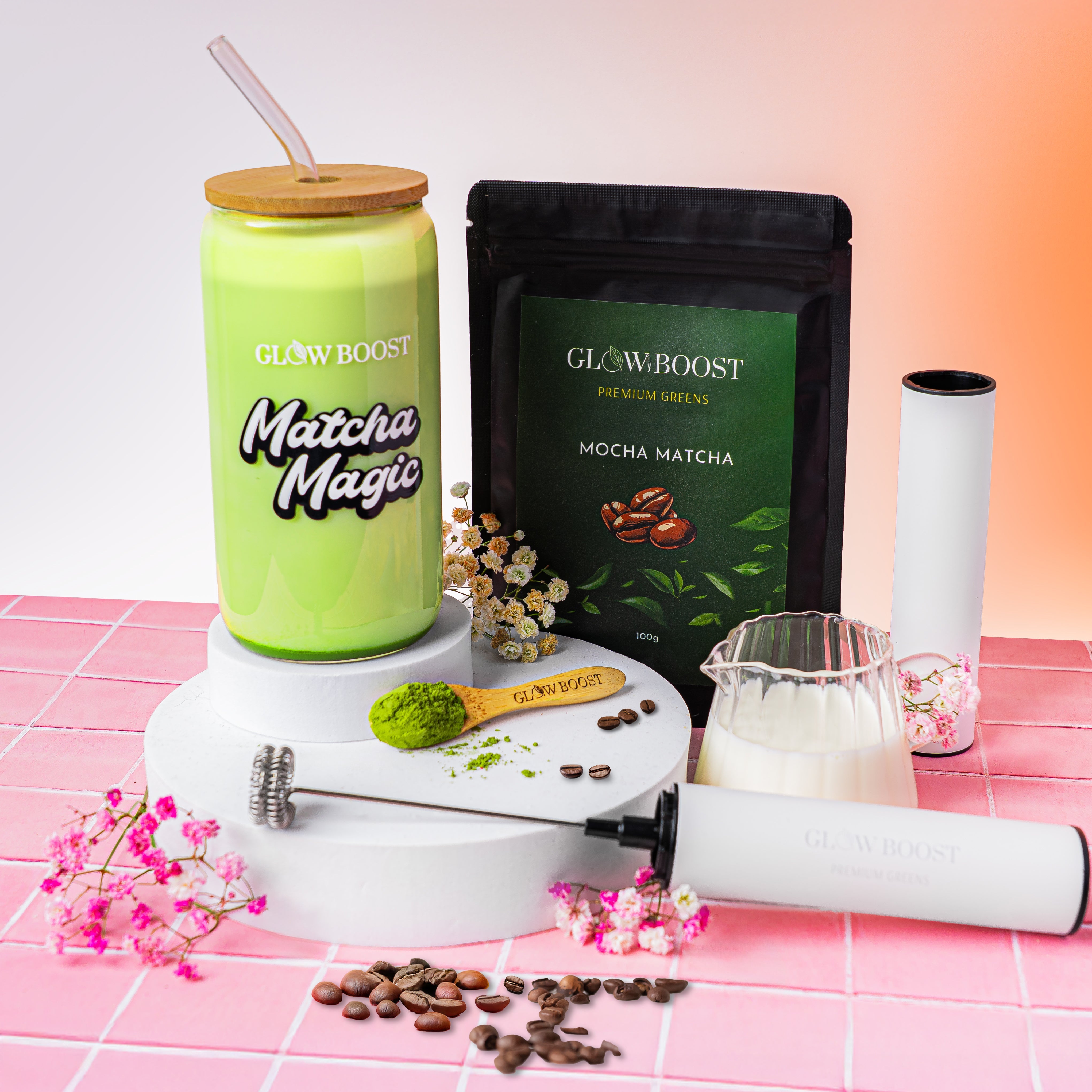 Green matcha drink with a straw, matcha powder, and coffee beans on a pink and white checkered surface.