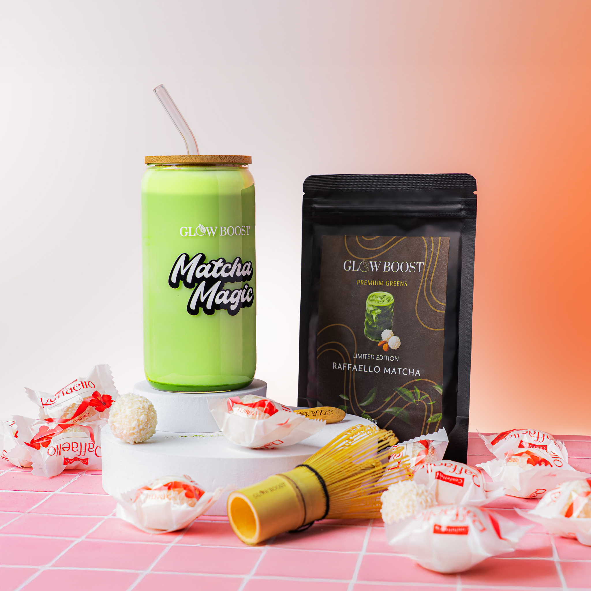 Green matcha drink container with 'Glow Boost' branding on a pink and white checkered surface.